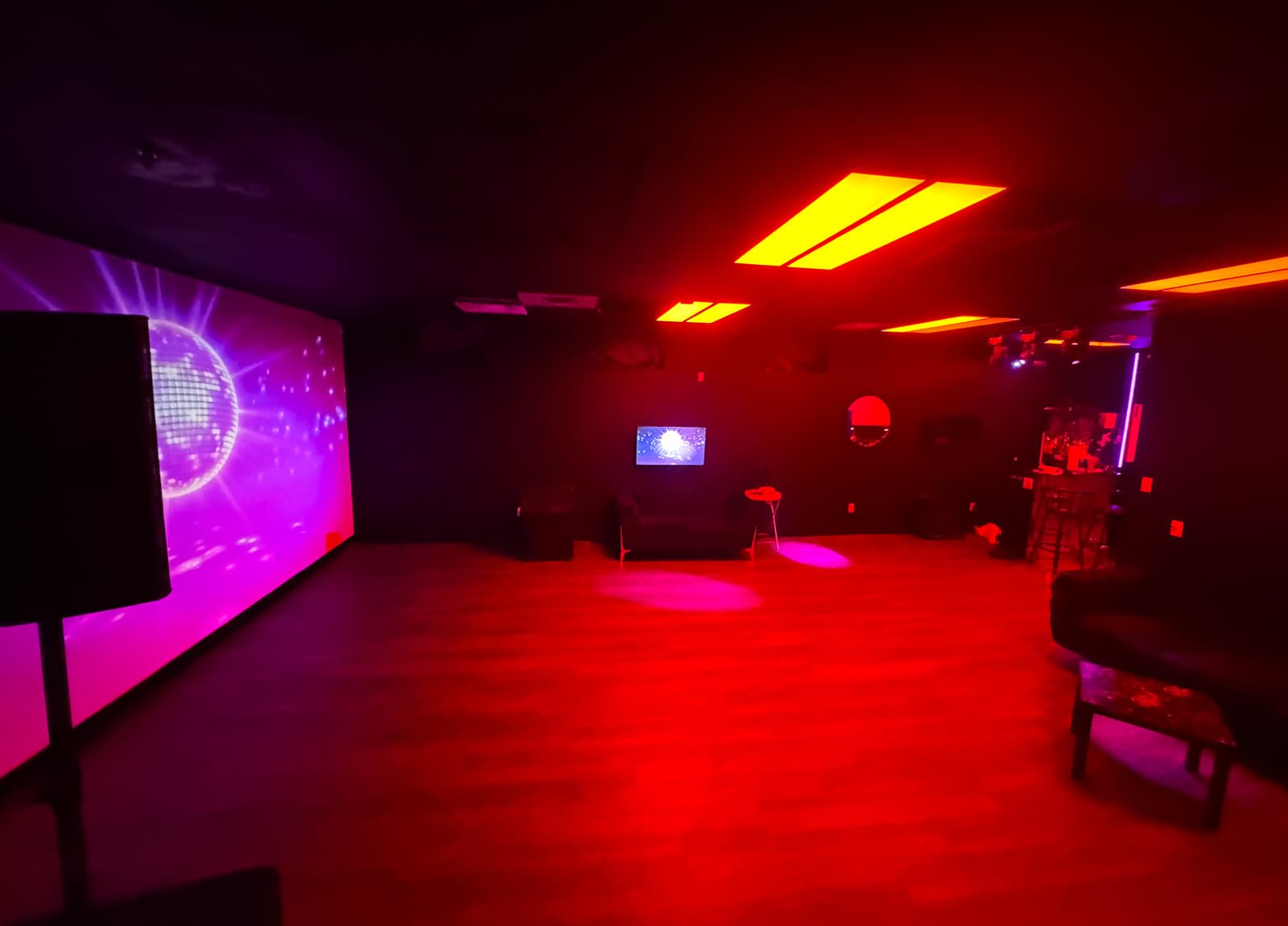 Empty dance floor under red ambient wash