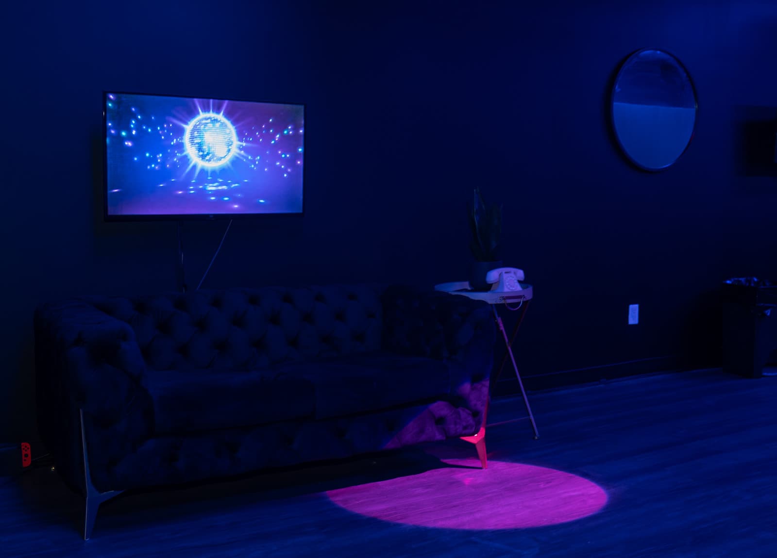 Blue velvet couch and warm detail lighting